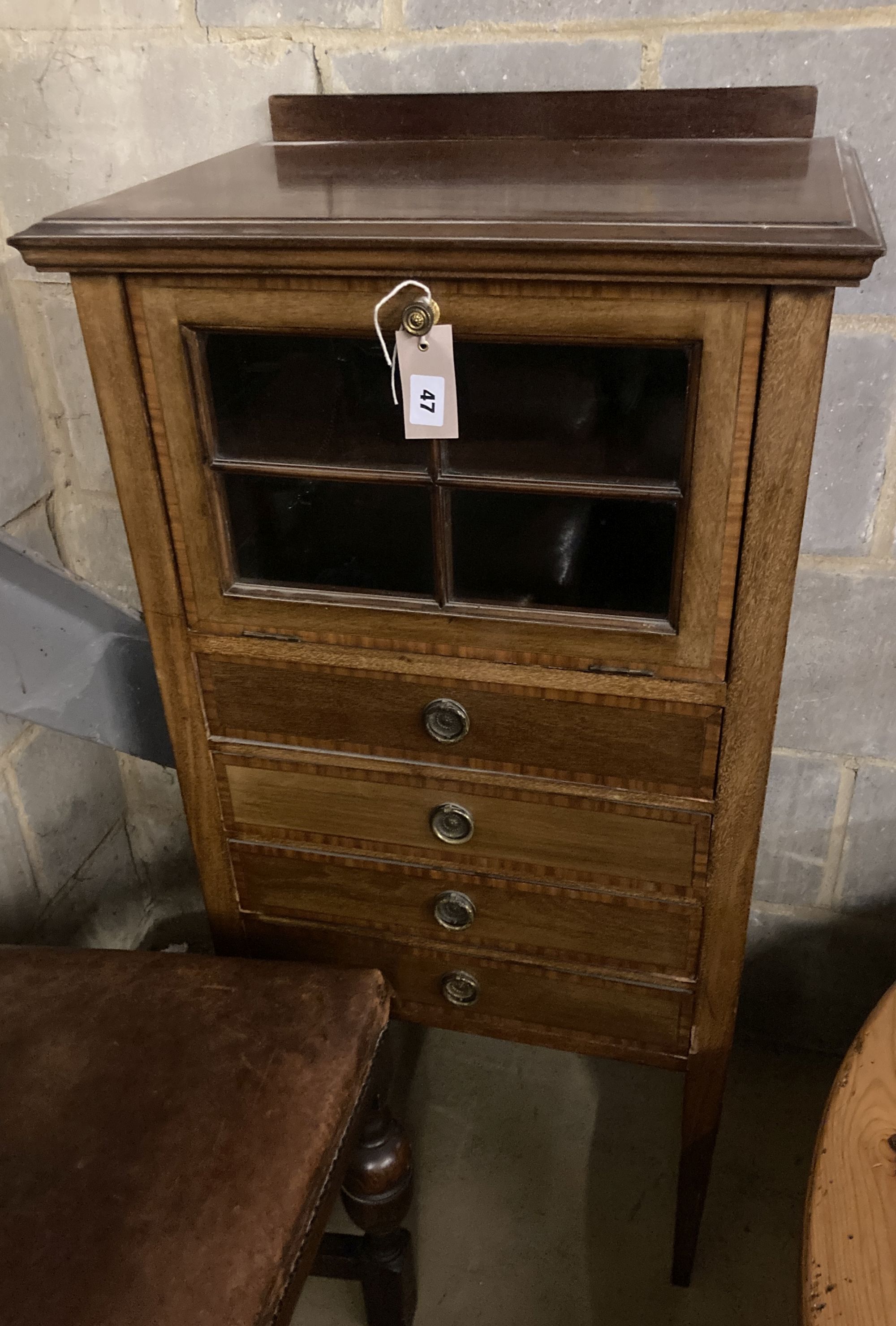 An Edwardian satinwood banded mahogany music cabinet, width 53cm depth 37cm height 108cm